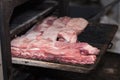 Smoking pork ribs in a large oven in a great pub.