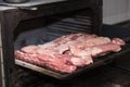 Smoking pork ribs in a large oven in a great pub.