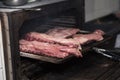 Smoking pork ribs in a large oven in a great pub.