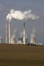 smoking power plant over the field Royalty Free Stock Photo