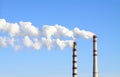 Smoking power station chimneys Royalty Free Stock Photo