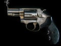 A smoking vintage Smith and Wesson .357 - .38 Special Pistol Handgun Firearm
