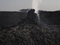 Smoking volcanic pinnacle close to Erta Ale volcano, Ethiopia