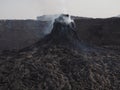 Smoking volcanic pinnacle close to Erta Ale volcano, Ethiopia