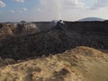 Smoking volcanic pinnacle close to Erta Ale volcano, Ethiopia