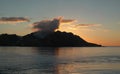 Smoking volcano at sunset.