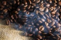 Smoking Whole Coffee Beans on Burlap Royalty Free Stock Photo