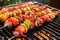 smoky barbecue grill with juicy shrimp on skewers