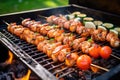 smoky barbecue grill with juicy shrimp on skewers