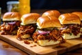 smoky bbq pulled pork sliders with pickles and onions