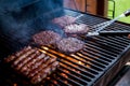 Smoky hamburger meat grilling for burgers. Fry on an open fire on the grill - bbq.Burgers and sausages Cooking Over Royalty Free Stock Photo