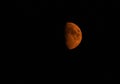 Smoky red half moon on black sky Royalty Free Stock Photo