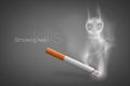 Smoldering cigarette with a smoke Royalty Free Stock Photo