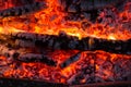 Smoldering embers of fire, live coals, burning charcoal in the background texture, closeup, glowing coal Royalty Free Stock Photo