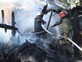 Firefighters extinguish a fire in an apartment house