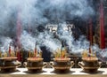 Smoldering sticks with fragrant smoke in the temples