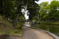 Smolensk, Russia â 09.17.2022: People in the park. People standing on the bridge. People floating on the lake on a catamaran