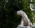 Smolensk, Russia - 09.17.2022: Stone Lion in Lopatinsky Garden park on a summer day. Lioness statue