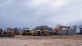 Smolevichi, Belarus - April 24, 2021. large crawler excavators standing at a construction site. excavators and