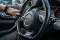 Smolqn, Bulgaria - march 22, 2019 - Man driving Audi, transportation concept, hands holding steering wheel white driving,road