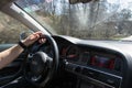 Smolqn, Bulgaria - march 22, 2019 - Man driving Audi, transportation concept, hands holding steering wheel white driving,road