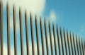 Smooth abstract illustration background. Fence vertical line gradation and the blue sky clouds in the backgrounds. Digital design