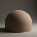 A smooth, beige, dome-shaped object is centered against a neutral background. The Royalty Free Stock Photo