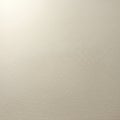 Smooth beige surface with a subtle texture, providing a minimalistic appearance. Light Royalty Free Stock Photo