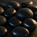 Smooth black pebbles, likely basalt, display a glossy finish. They vary in size and Royalty Free Stock Photo
