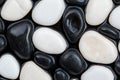 Smooth black and white river stones Royalty Free Stock Photo