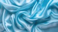 Smooth blue satin fabric texture. Luxurious silk material background for design and print Royalty Free Stock Photo