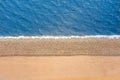 Smooth border between sea and land. Stones mound of sand and water, top aerila view Royalty Free Stock Photo