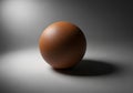 A smooth, brown sphere sits on Royalty Free Stock Photo