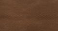 Smooth brown suede leather texture, with a soft and slightly napped surface. The Royalty Free Stock Photo