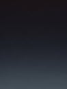 A smooth, dark gray to black gradient background with a subtle, almost imperceptible shift in tone creating a minimalist and clean Royalty Free Stock Photo