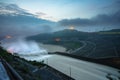 Smooth draining water from the hydroelectric dam at dawn Royalty Free Stock Photo