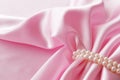 Smooth elegant rose silk background with pearl, Beautiful silk drapes Royalty Free Stock Photo