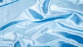 Smooth elegant wavy pastel light blue satin silk luxury cloth fabric texture, abstract background Royalty Free Stock Photo