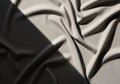 Smooth fabric, likely satin or silk, folded into flowing, irregular Royalty Free Stock Photo