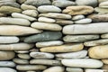 Smooth flat sea stones are stacked on top of each other