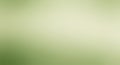 A smooth gradient background with light green hues transitioning from a deeper green Royalty Free Stock Photo