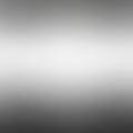 A smooth gradient background shifting from light gray to dark gray, creating a seamless transition. Royalty Free Stock Photo
