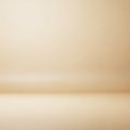 A smooth gradient beige background with a subtle, blurred texture. The image has a soft, even tone Royalty Free Stock Photo