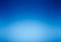 A smooth gradient transitioning from a lighter blue at the center to a darker blue towards the Royalty Free Stock Photo