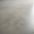 Smooth gray concrete floor with a matte finish, displaying minor cracks and small Royalty Free Stock Photo