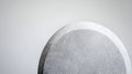 Smooth gray stone against minimalist white background Royalty Free Stock Photo