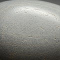 Smooth, gray stone surface with subtle veining and fine texture. The image shows a Royalty Free Stock Photo