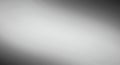 Smooth grayscale gradient background transitioning from dark to light. The gradient