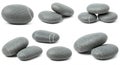 Smooth grey stones with white streaks, arranged in various groupings and angles. The Royalty Free Stock Photo