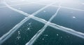 Smooth ice covers a large body of water, creating a natural grid pattern with Royalty Free Stock Photo